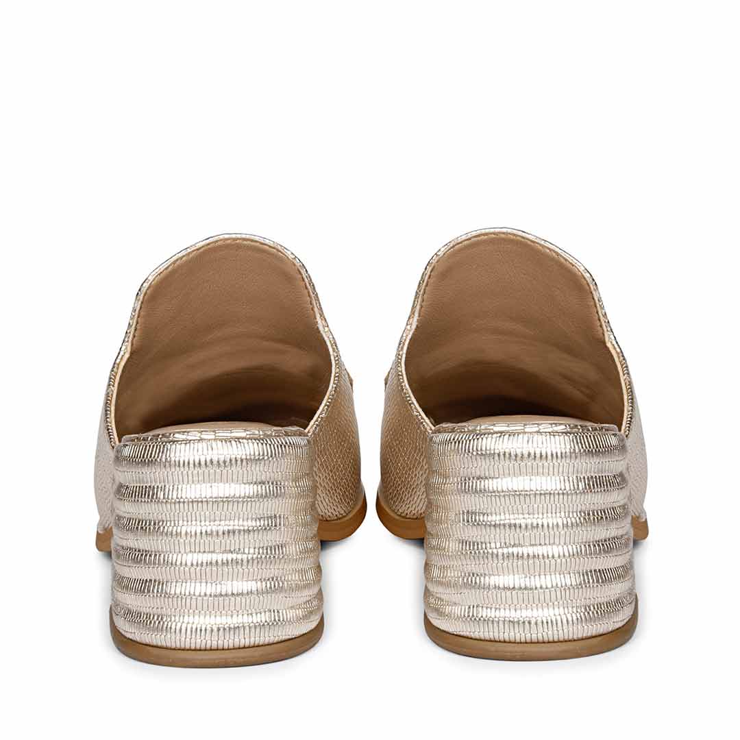 Golden Elegance: Saint Jasmine Lizard Print Leather Mocs, a blend of style and comfort.