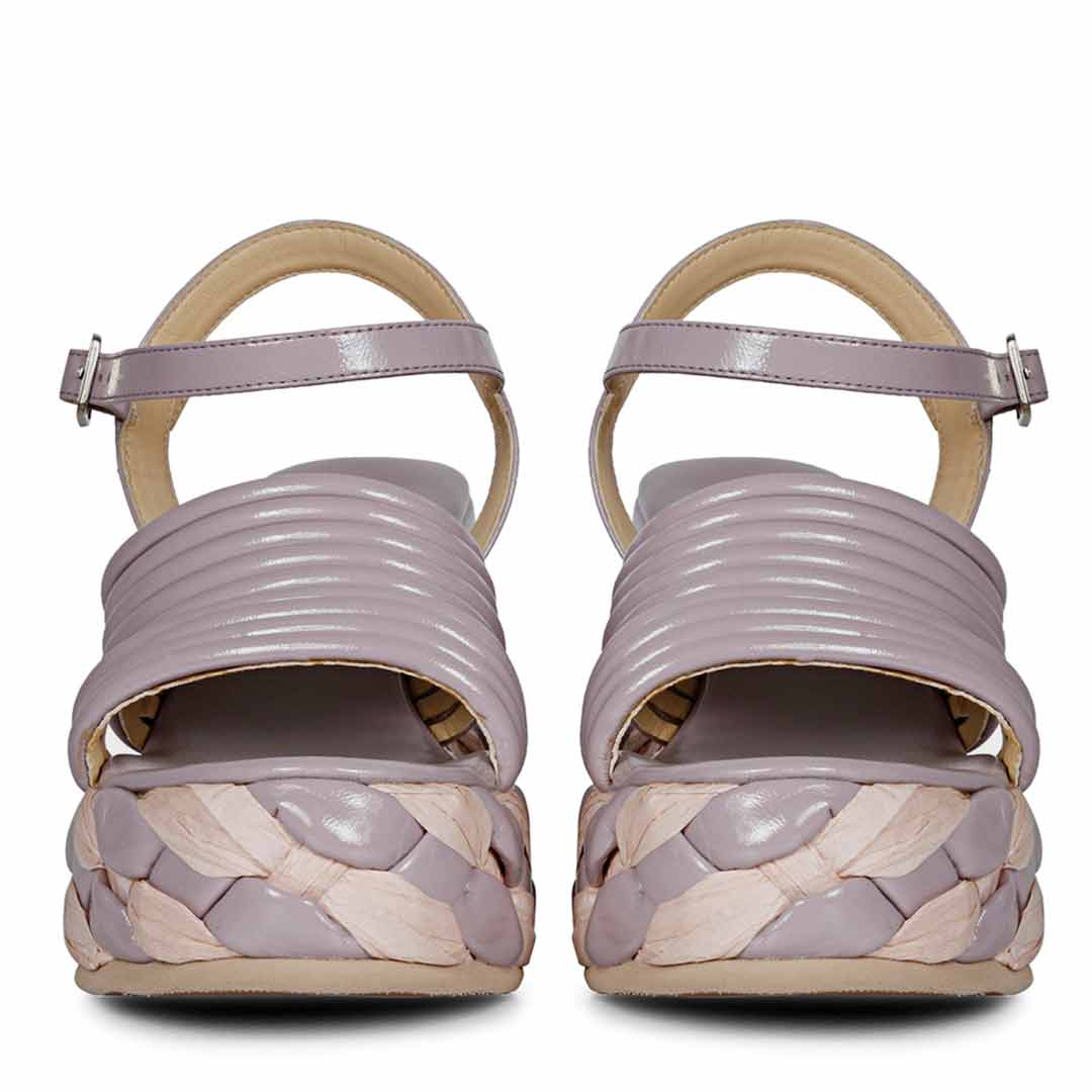 Step out in fashion with lilac leather platform sandals."