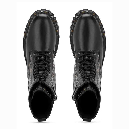 Sleek and edgy SAINT NATALIE boots with metal studs, lace-up design, and high ankle for a stylish look