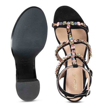 Striking black heels with intricate stone detailing by Saint Gretel.