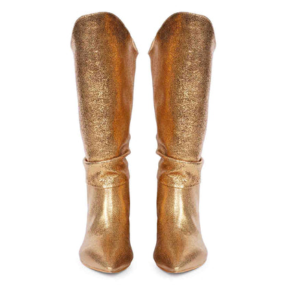 Versatile and glamorous, Saint Nayeli's gold metallic slouch boots for any outfit.