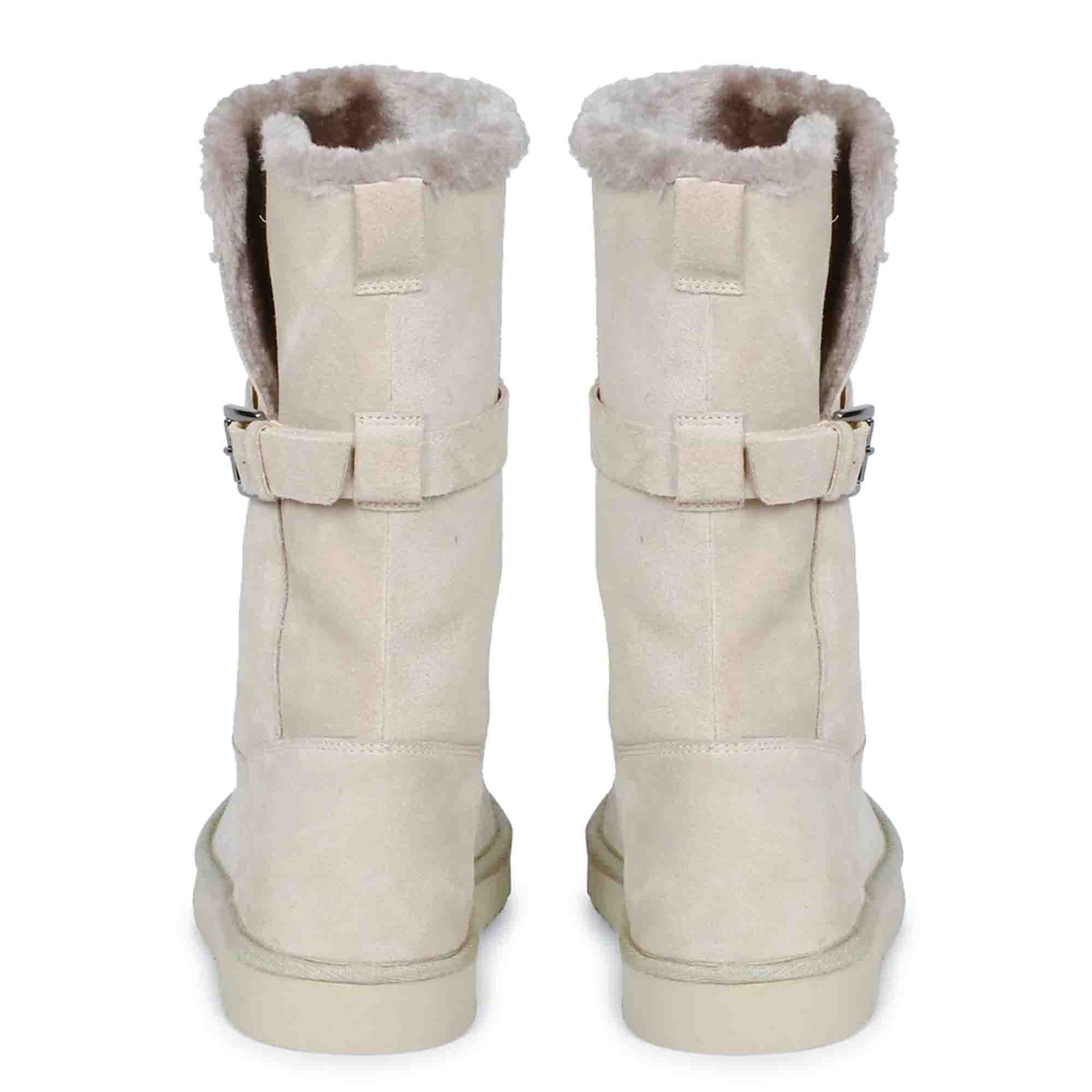 Chic ivory suede boots with decorative buckle, crafted by Saint Aurelia for snug comfort and style